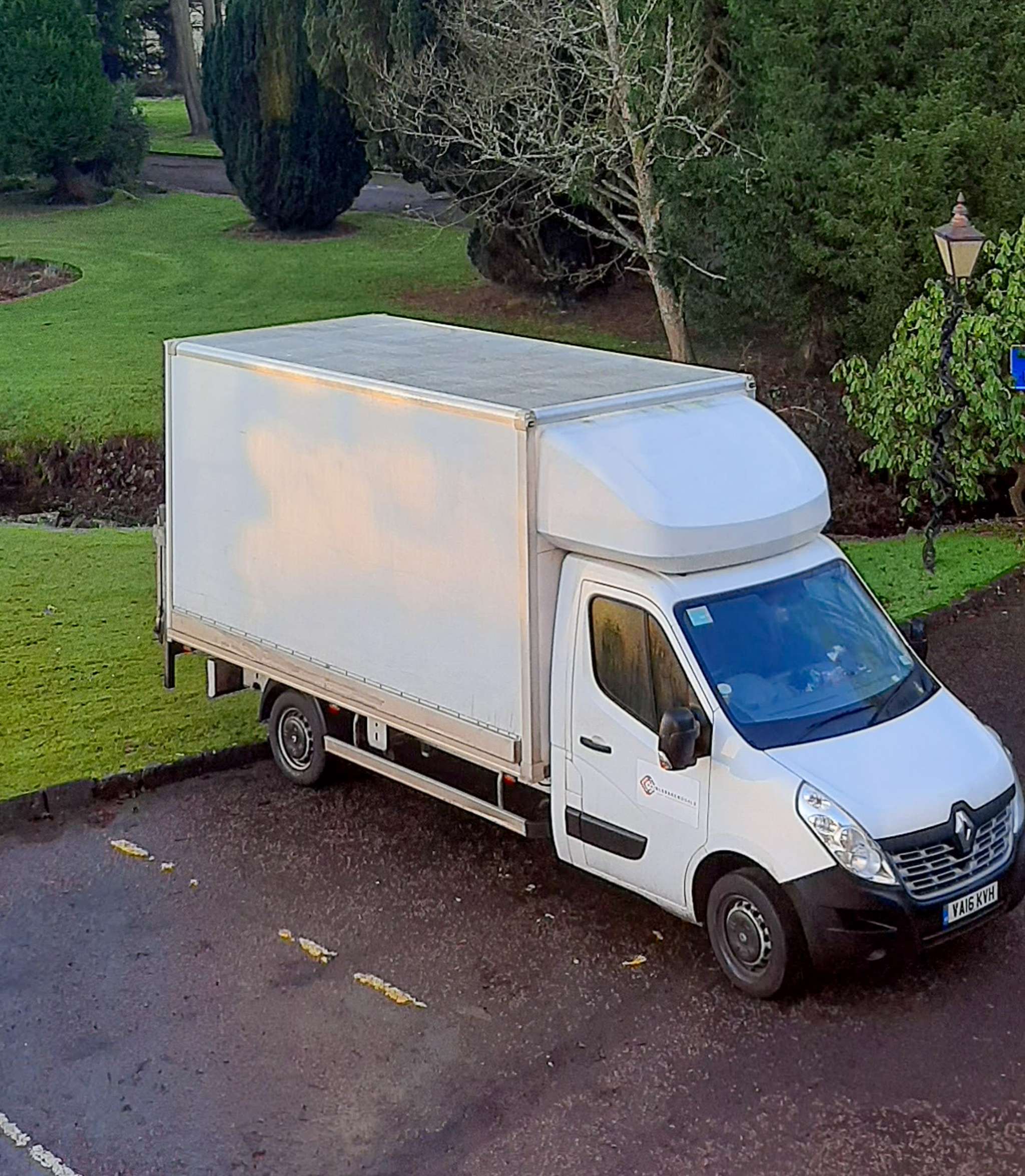 Removal crew navigating Edinburgh tenement stairs during a long-distance move from Bristol