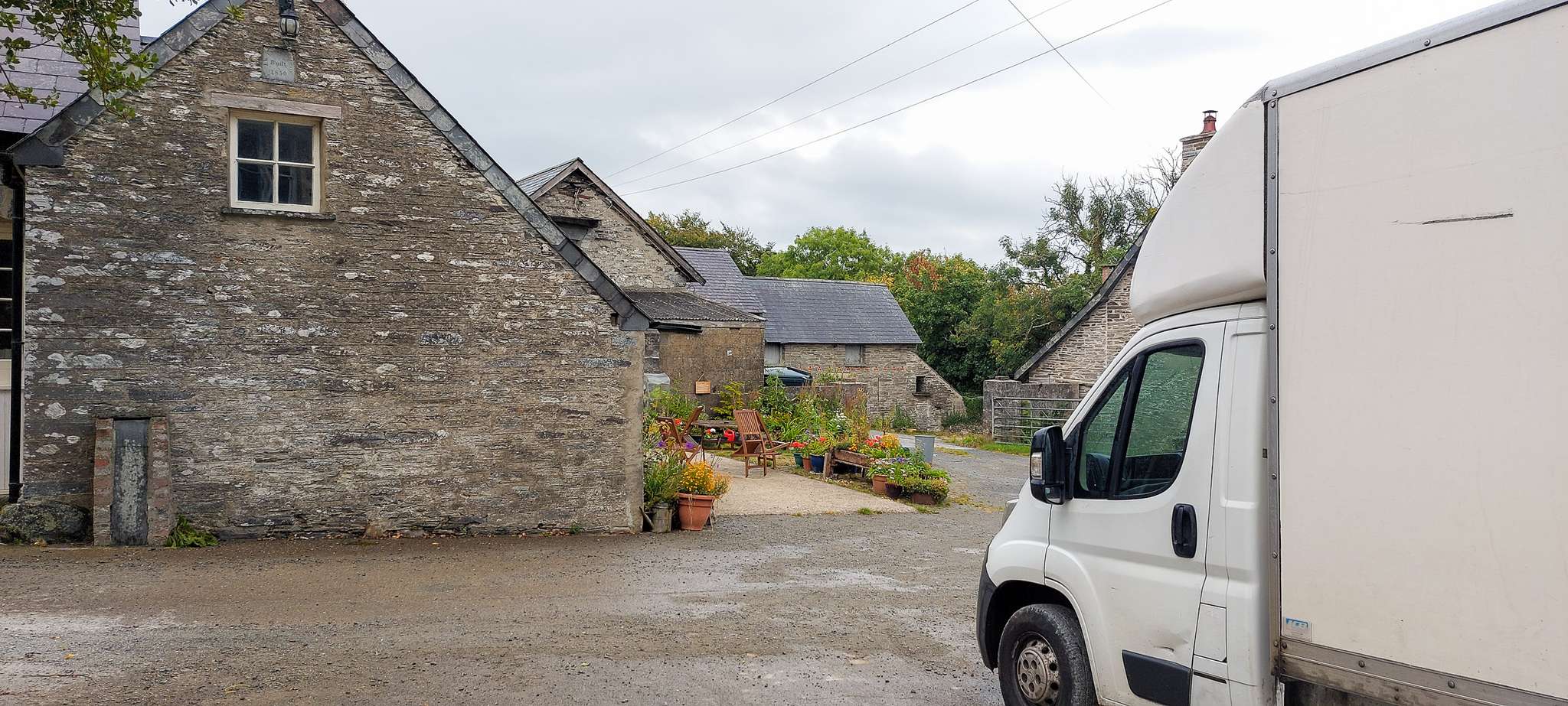 Painless Removals van at a property in Wales after a long-distance removal from Bristol